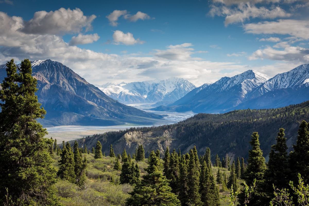 Mountain valley with green landscape and lake view